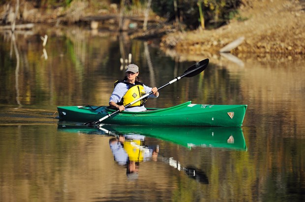 Senior adult paddling a kayak on the Des Plaines River