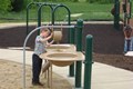 Young boy playing in the sand.