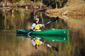 Senior adult paddling a kayak on the Des Plaines River