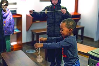 Young boy playing in a classroom