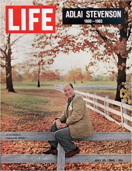 Adlai E Stevenson sitting on the white rail fence in his backyard