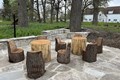 Chairs and tables carved from tree stumps.