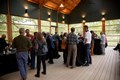 Gathering of people at an outdoor reception.