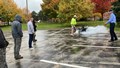 Firefighter training students how to use fire extinguishers properly.