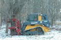 Restoration ecology crew removing a large dead tree.