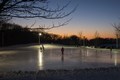 Beautiful photo of the sunset over the ice skating rink
