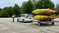 Safety committee member checking the the trailer hitch on a vehicle