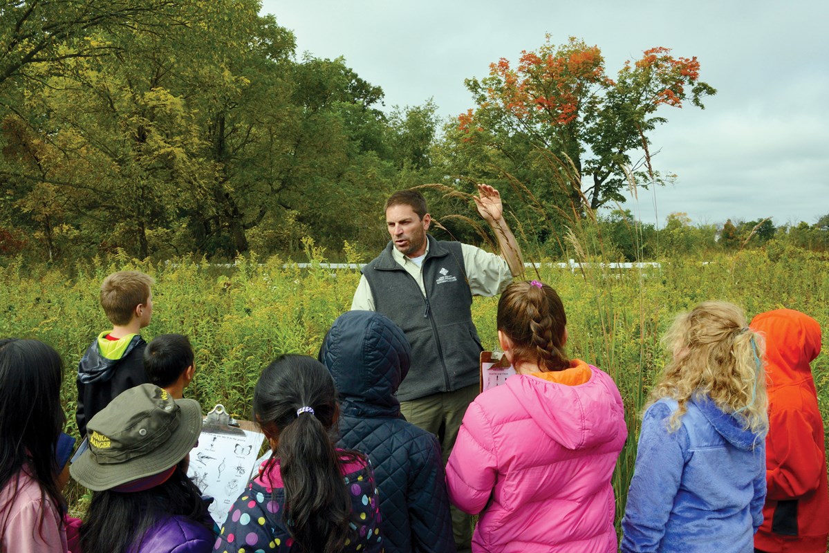 Instructor teaching students about plant seeds